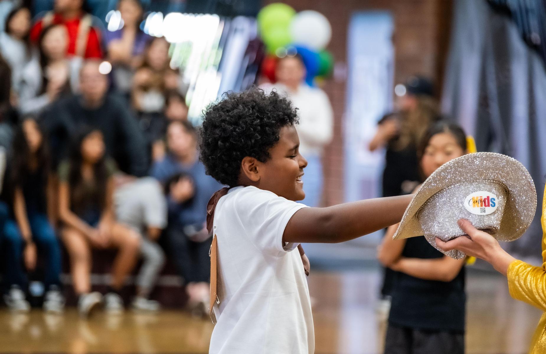 stuudents selects item from hat