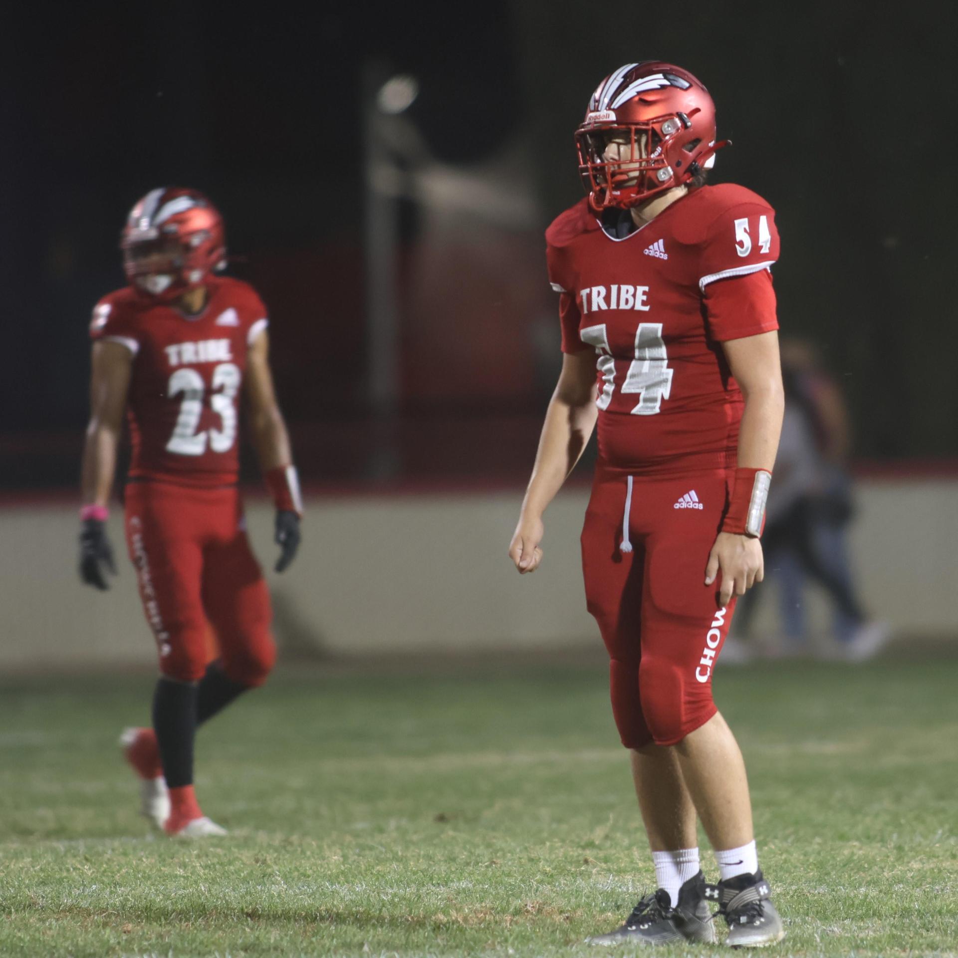 varsity boys playing football against Fowler