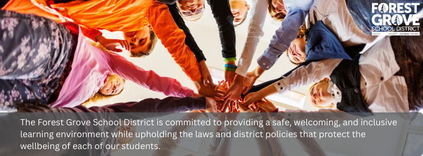 Circle of students putting a hand into the middle