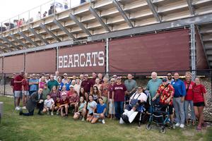 Family and friends of Brad Dusek gather before the field naming ceremony