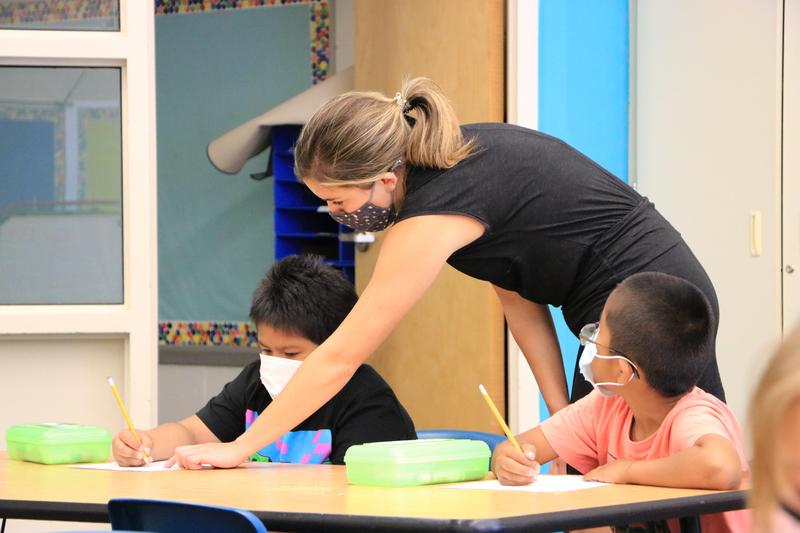 Teacher helps student