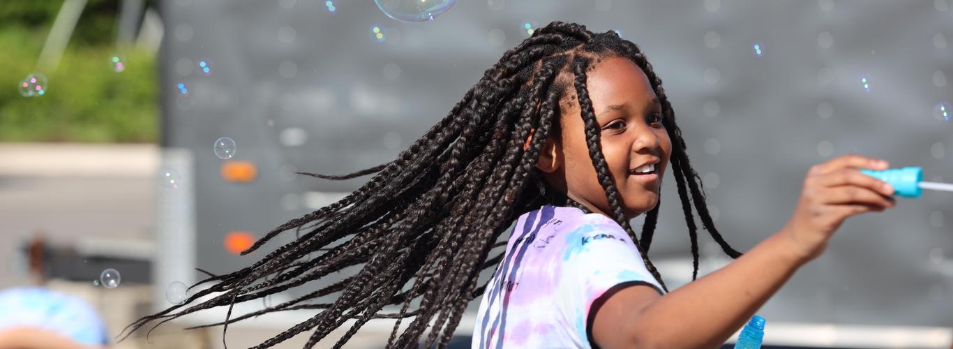Girl blowing bubbles