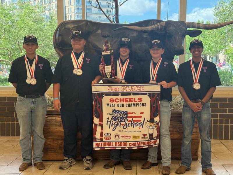 THS BBQ Team poses with fifth place trophy at National Cookoff