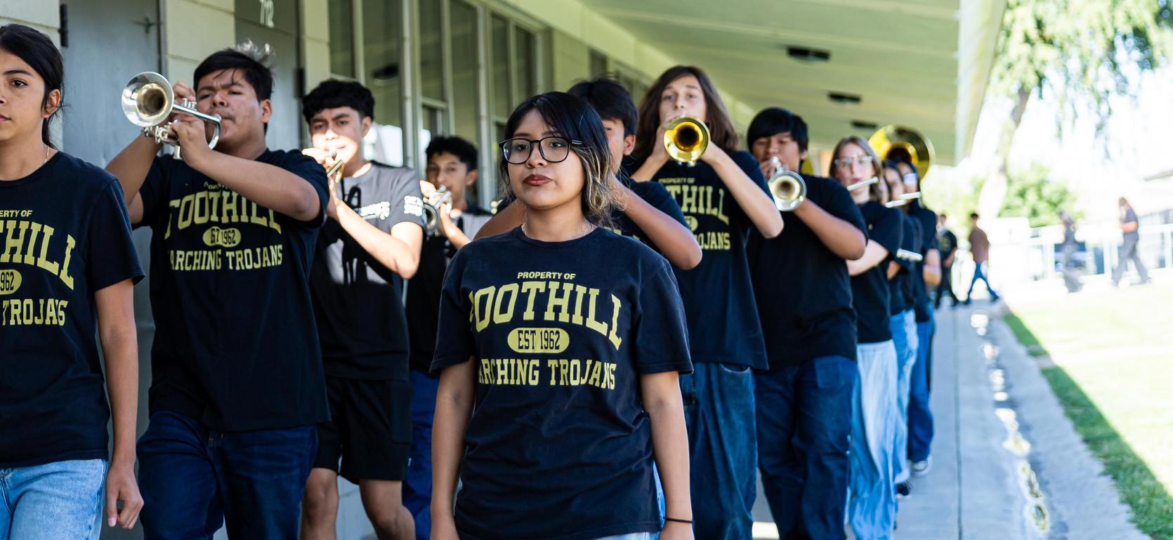 Trojan marching band marching the halls