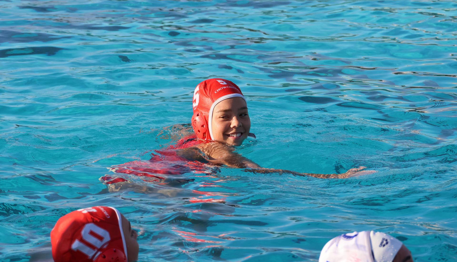 girls playing water polo against Sanger West