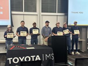 Luis with other graduates