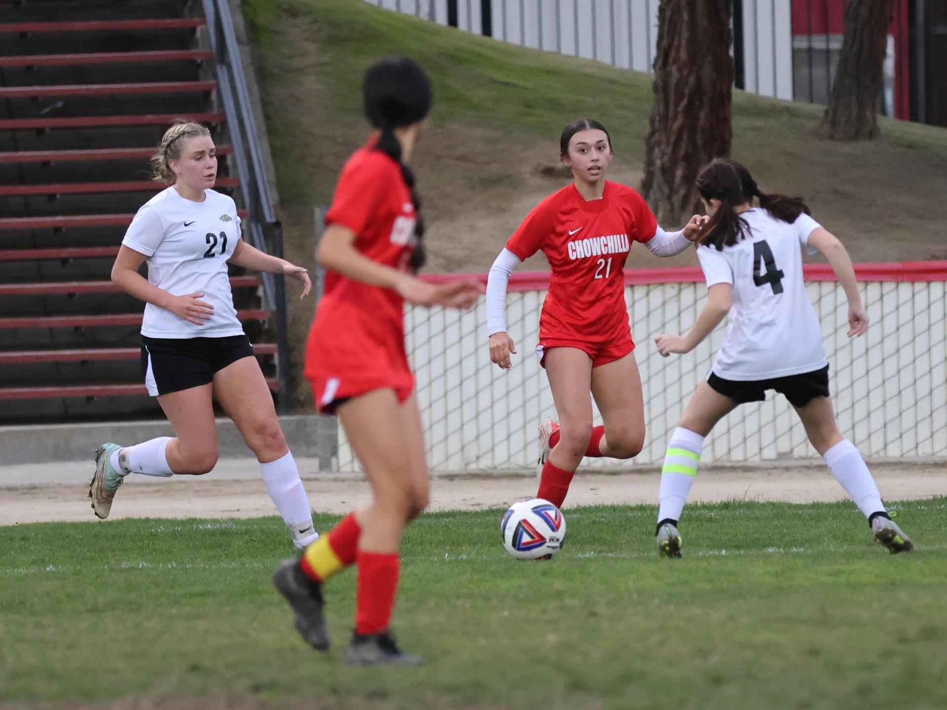 Junior varsity girls playing soccer against liberty