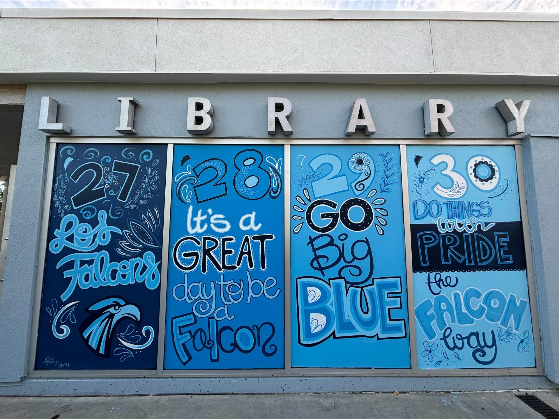 Colorful mural on a library showcasing school spirit and pride.