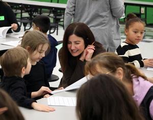 Buchanan Elementary students share writing with adults.