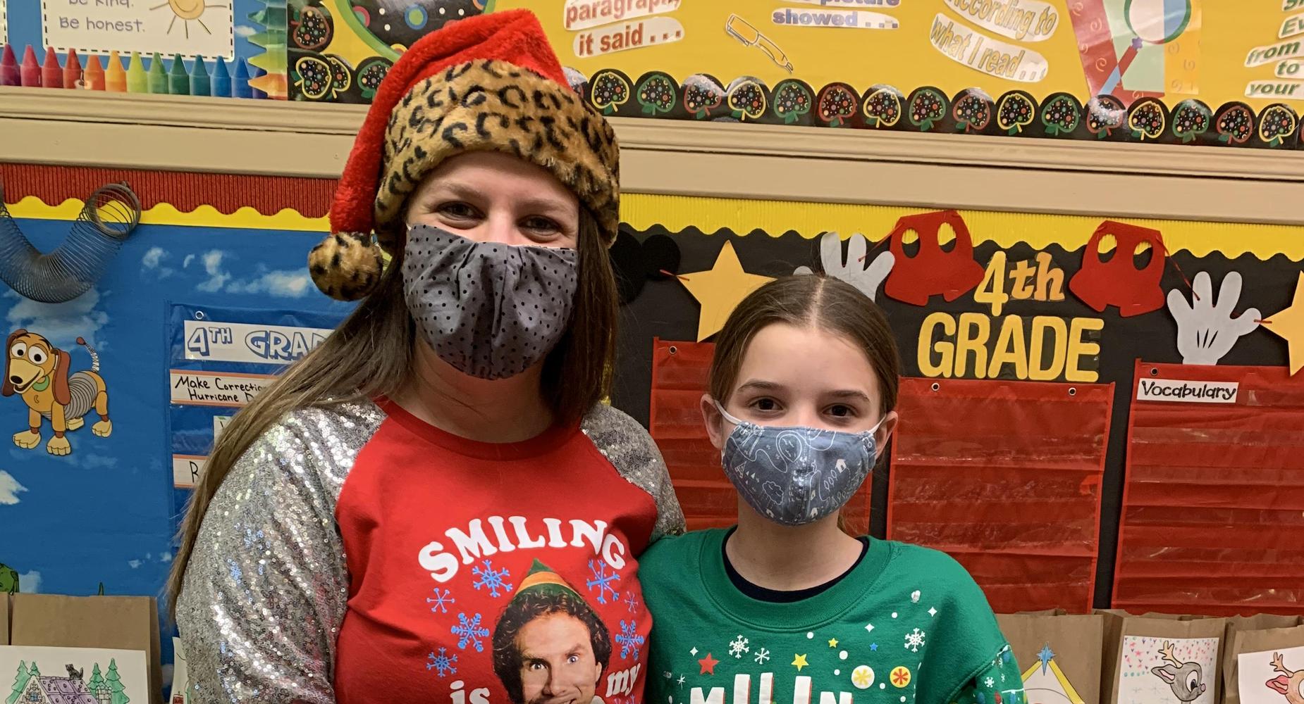 teacher and student in ugly Christmas Sweaters
