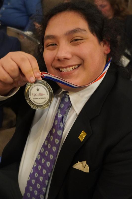 MHS student showing off State BPA medal