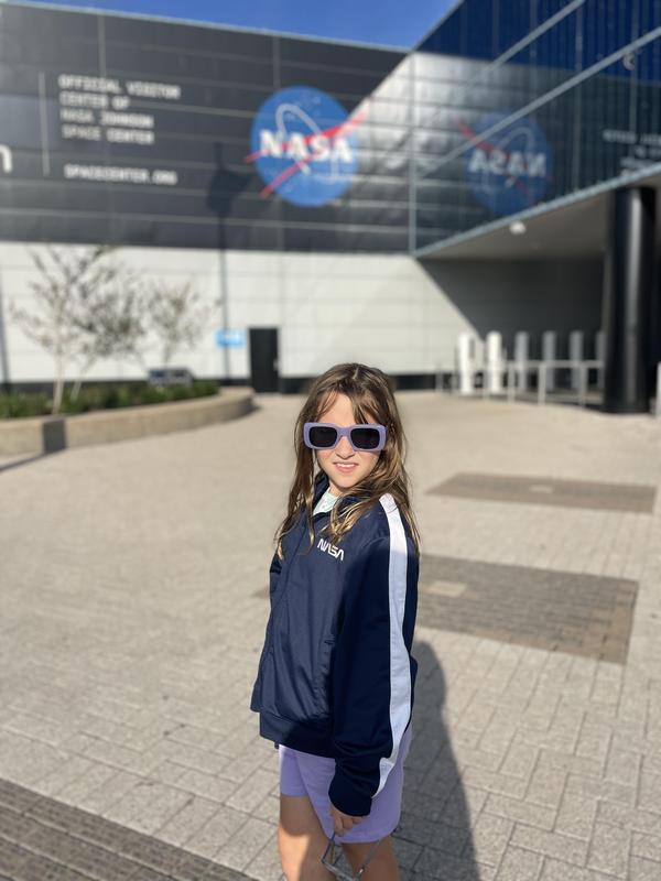 Lilly stands outside the NASA center in Texas.