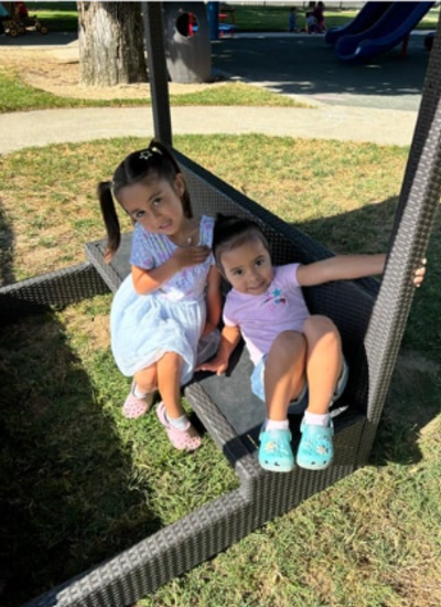 Two students sitting and smiling