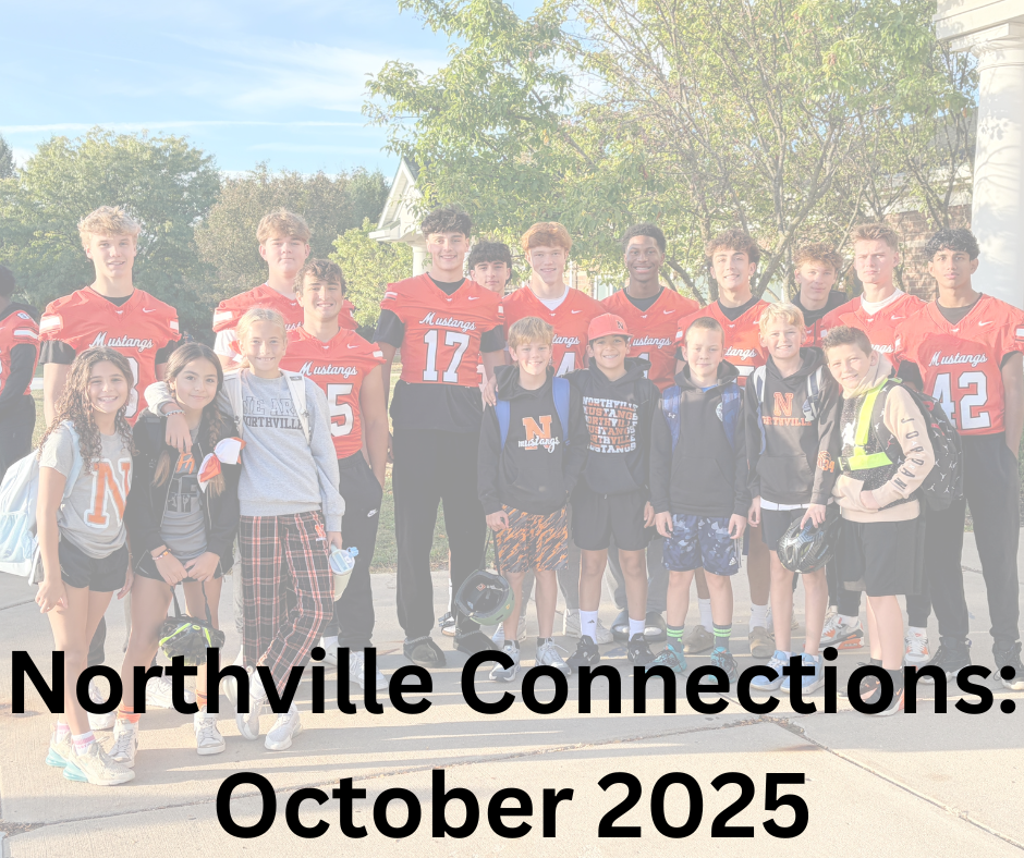 Varsity football players standing with students from Ridge Wood Elementary.