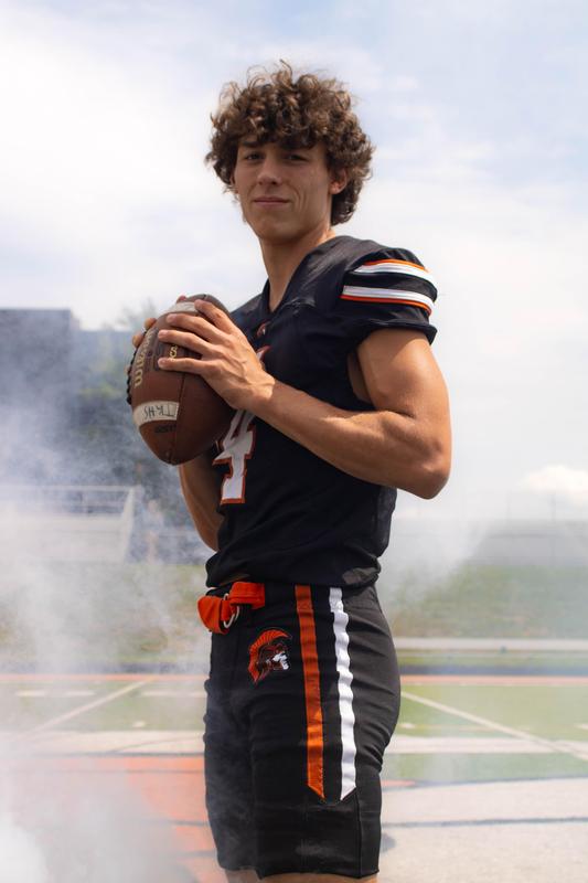 A football player posing in a photo taken by senior Cayla Brouwer.
