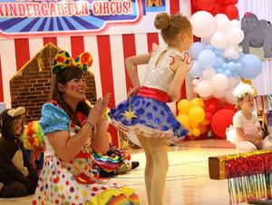 Student wearing a tutu and bowing
