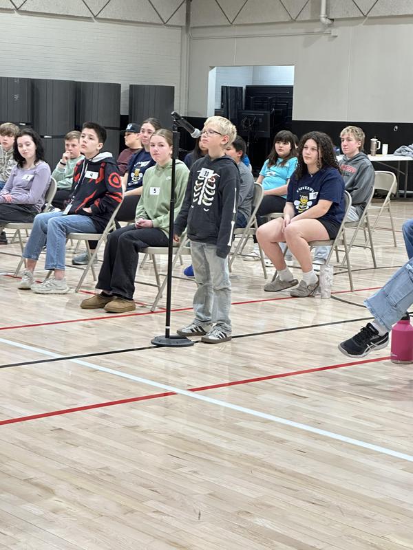 Students competing at spelling bee