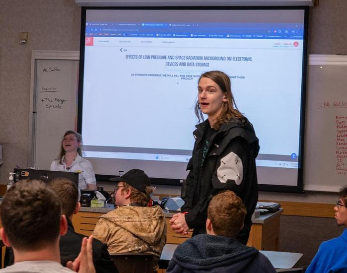 students in classroom learning about getting an award