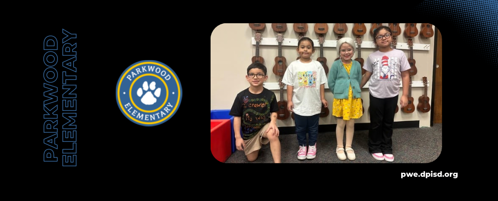 Five children stand together in a classroom, wearing colorful outfits with instruments in the background.
