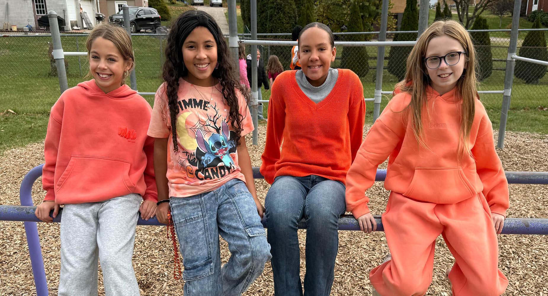 Mrs. Scavincky's students at Harrison Park play on the playground