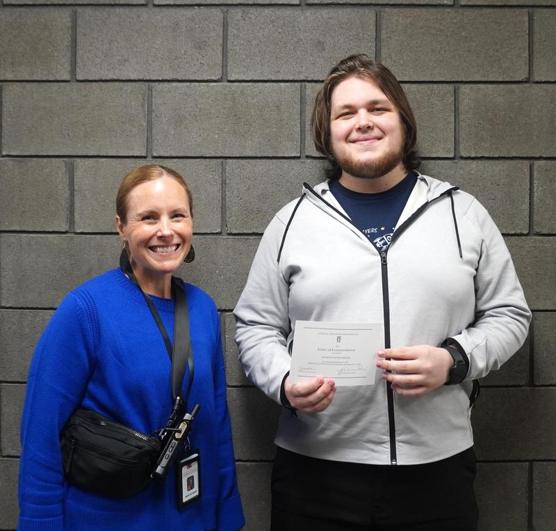 TKHS Principal Katie Dorband presents Anthony Sager-Wissner with a commended student certificate.