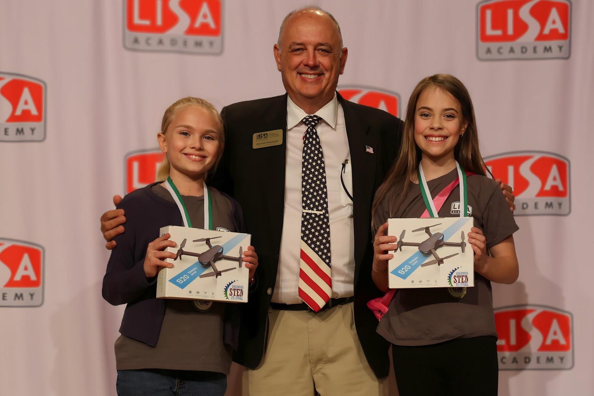 LISA Academy elementary STEM festival winners with their drone prizes
