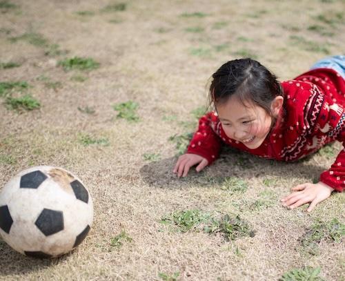 Child who has fallen playing soccer
