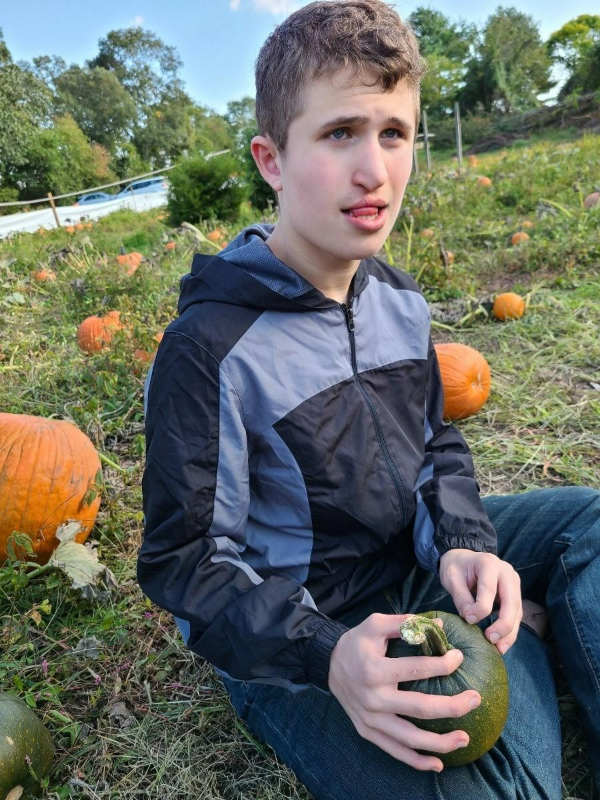 Young man holding a gourd