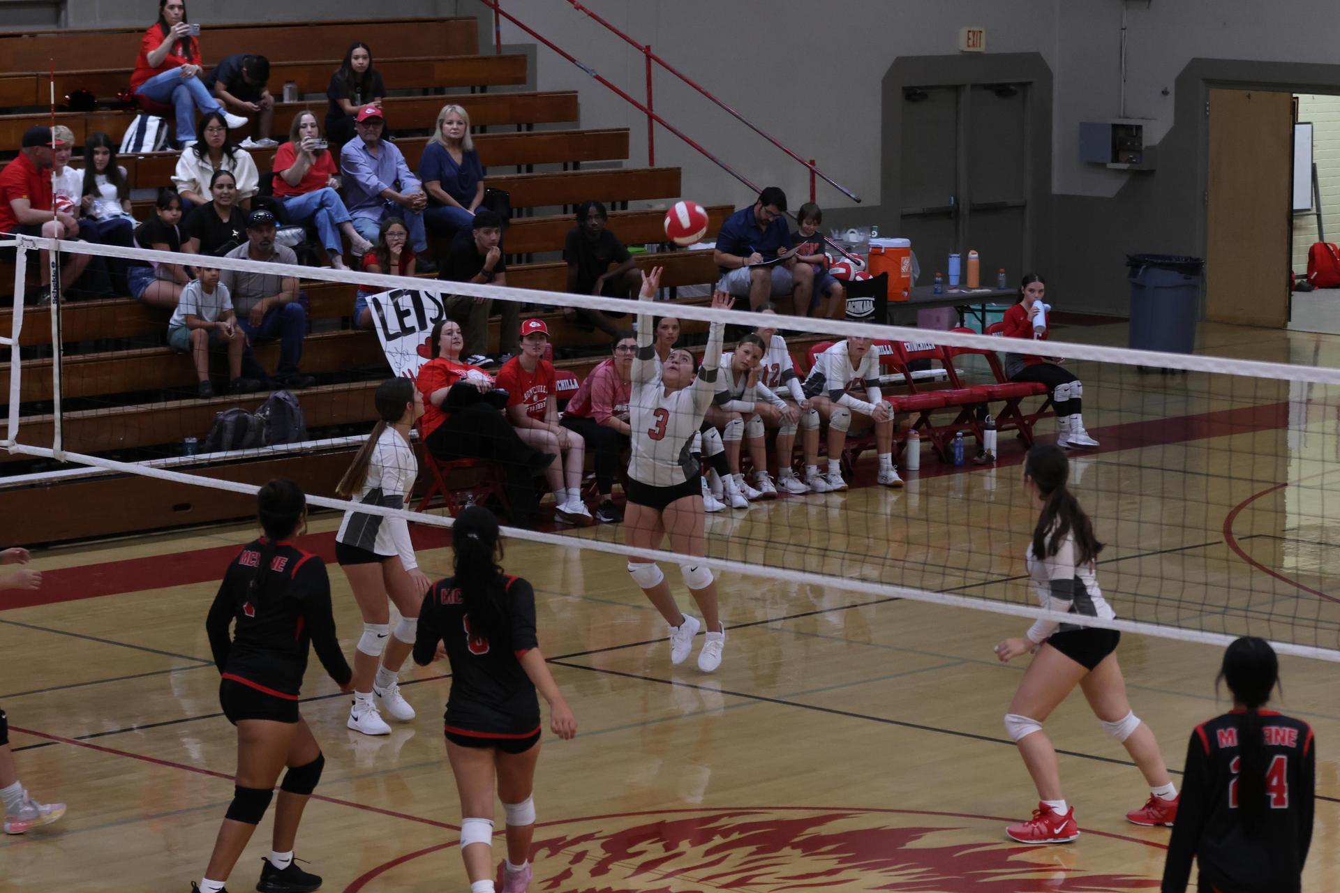 junior varsity girls playing volleyball 128