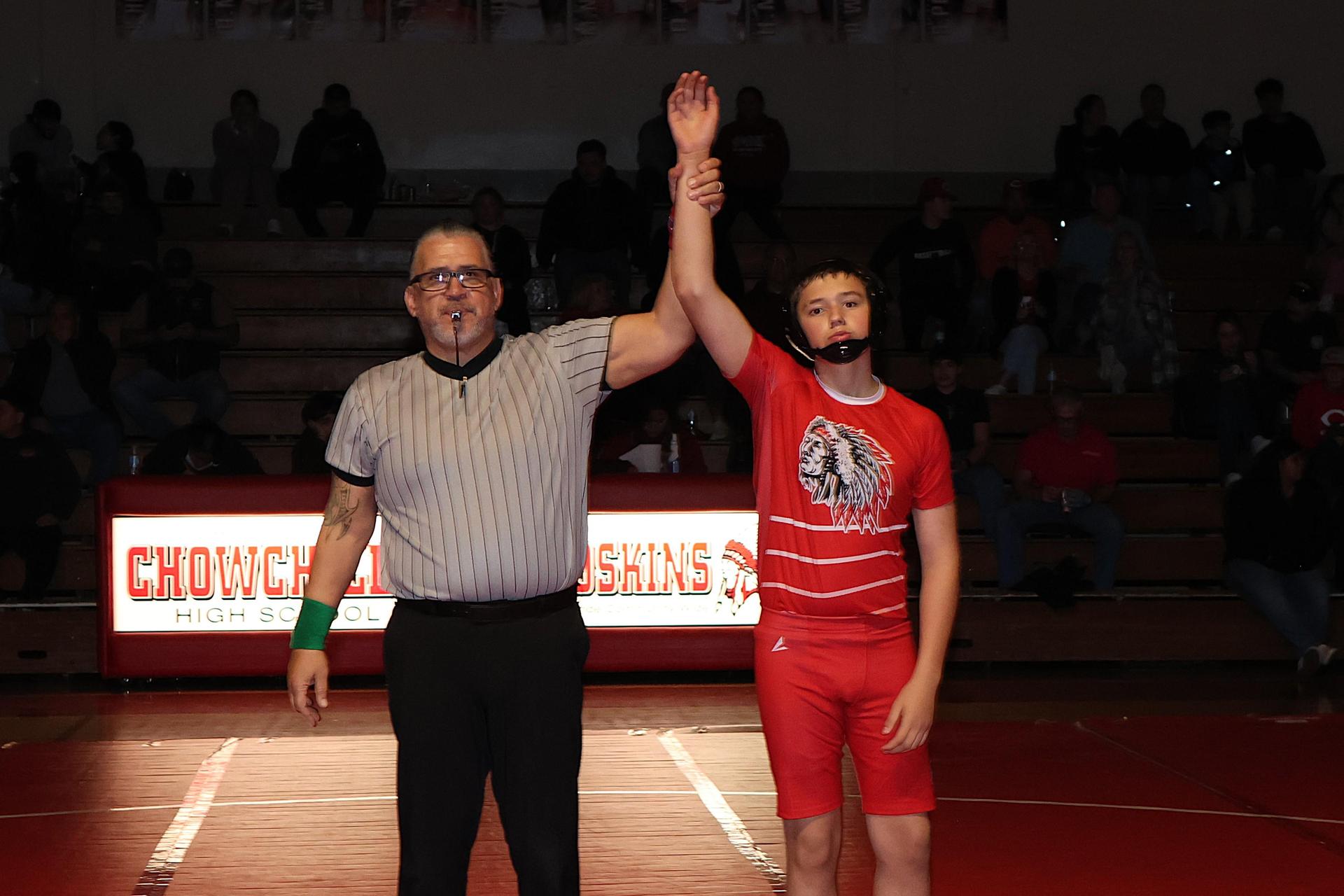 Wrestling winners with hands up 90