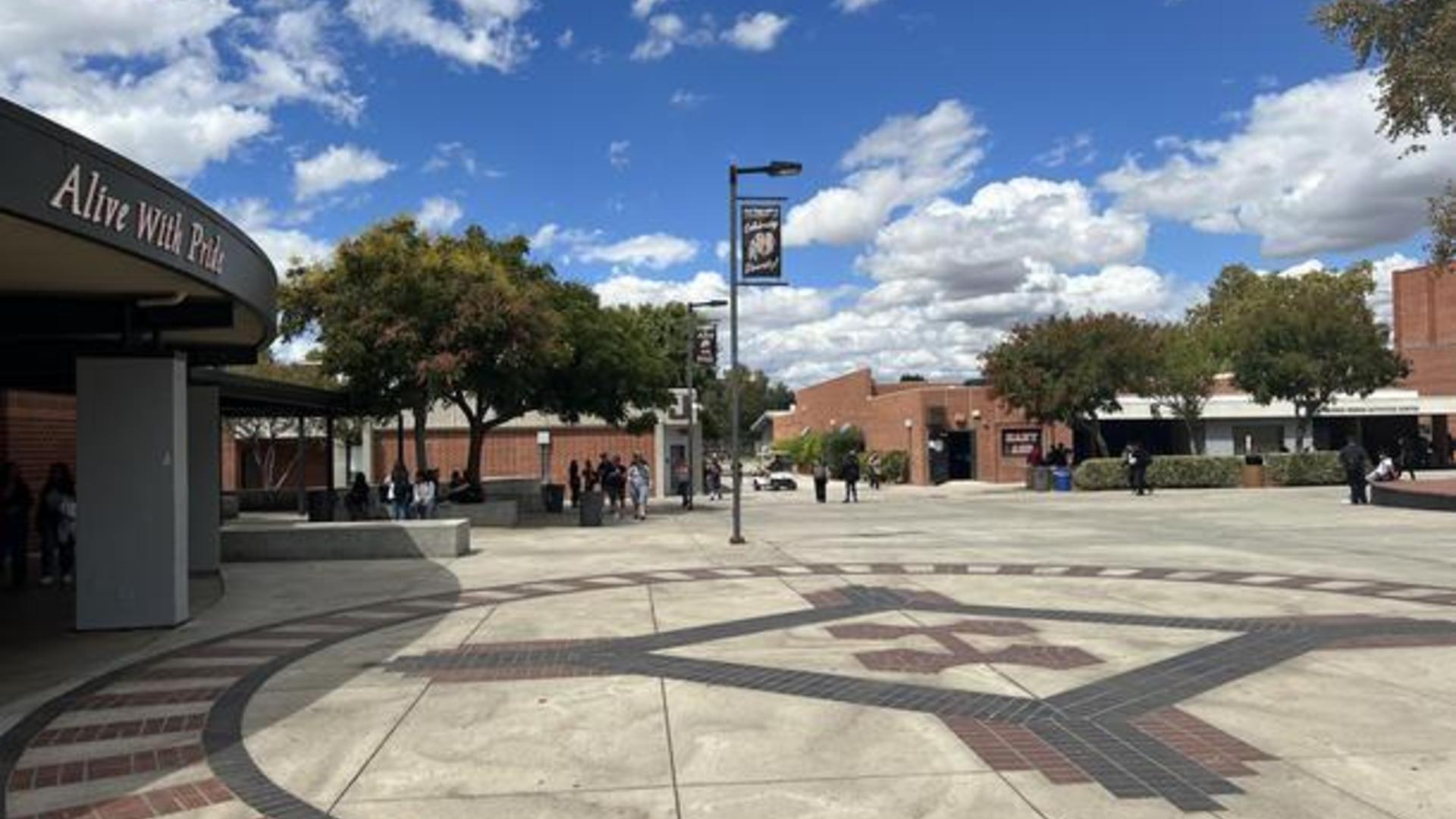 Students walking through the Hart High School quad on a cloudy day