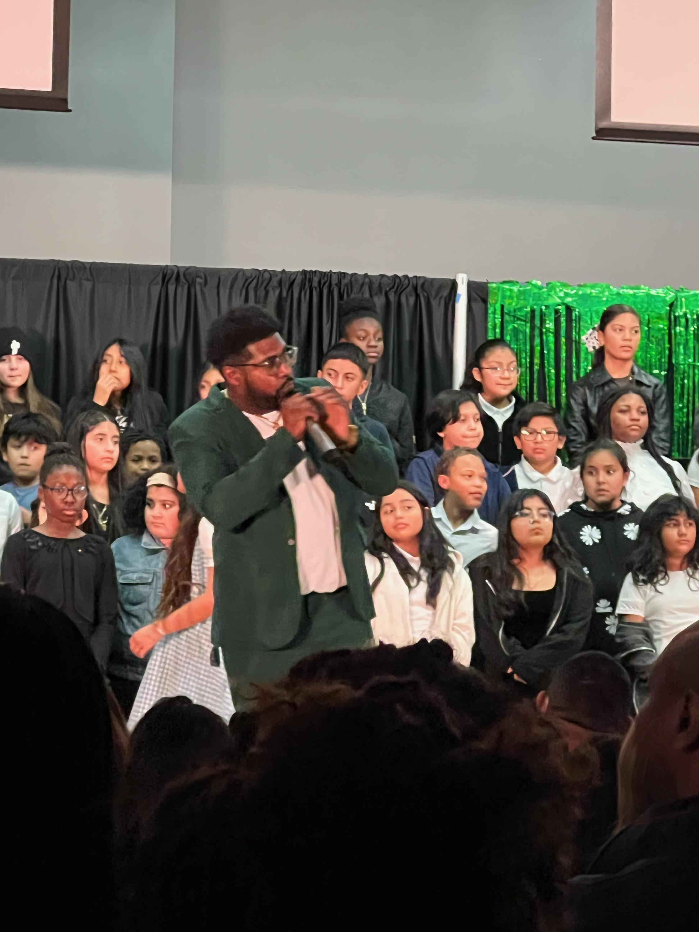 Teacher conducting chior at the winter concert  