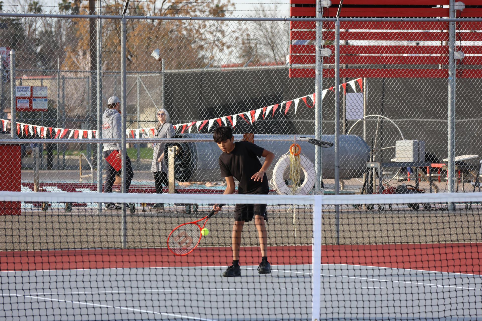CUHS Boys playing tennis against coalinga