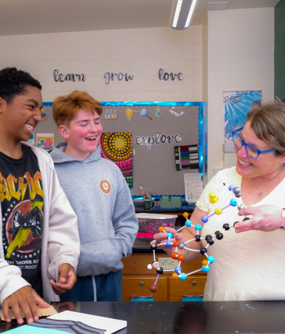 Students and teacher in science class