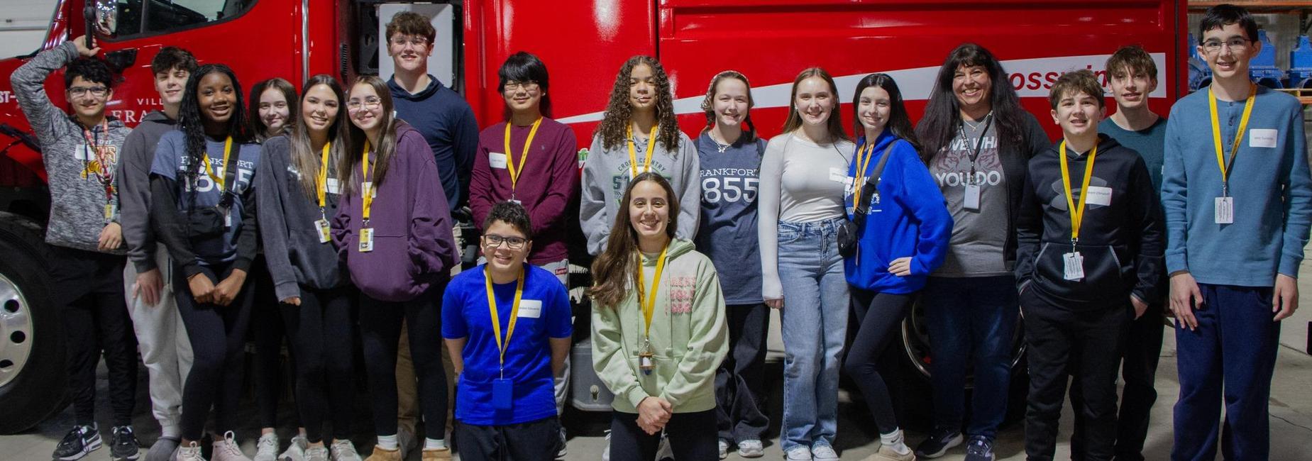 Group of students posing in front of a Village of Frankfort truck during Student Government Day.