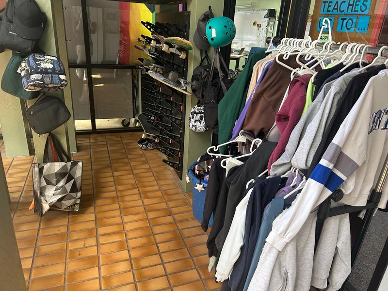 Lost and found area with hoodies, water bottles and lunchboxes.