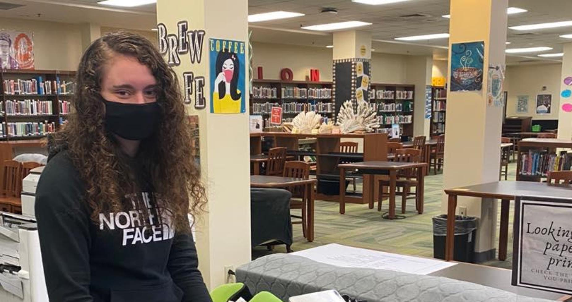 Student printing papers in the GHS Library