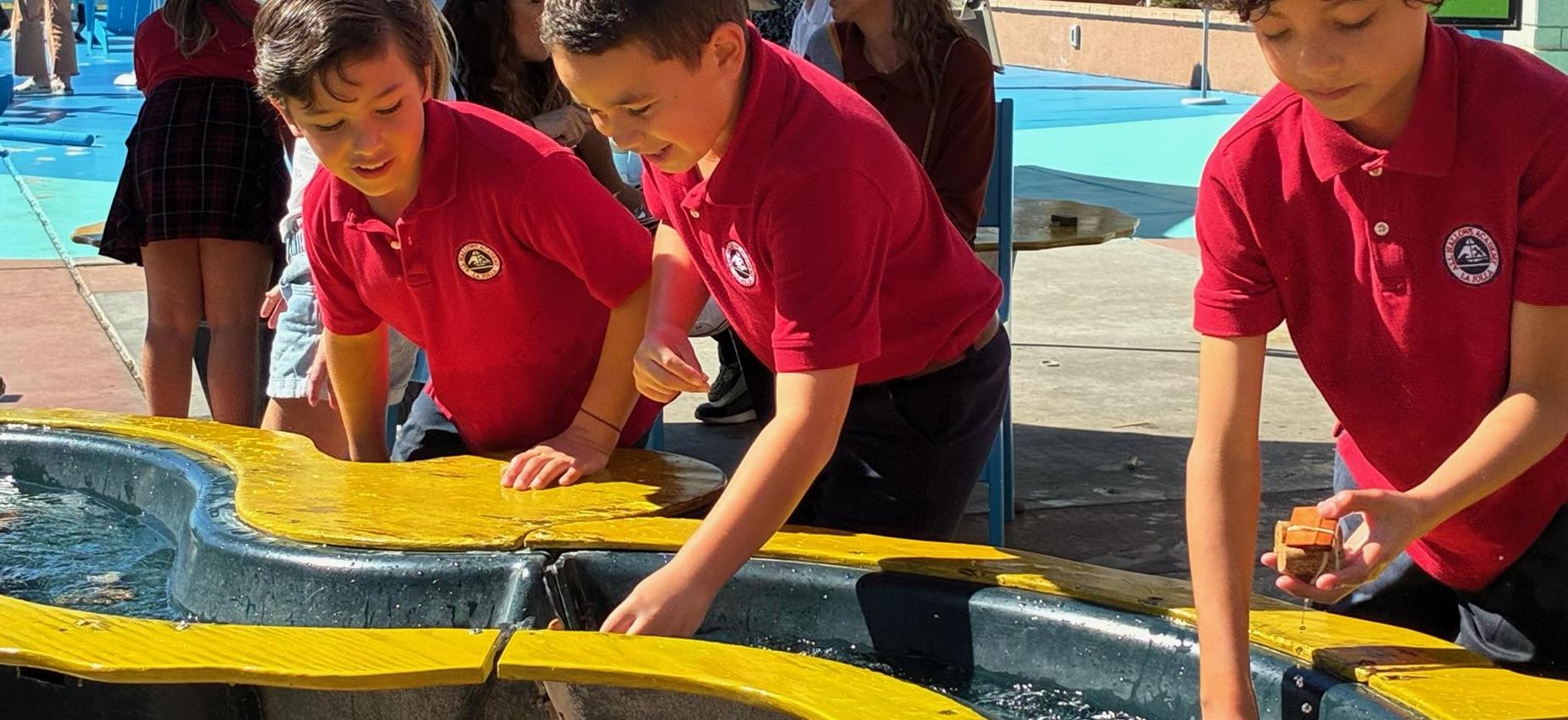 3rd grade students explore tide pool at Birch Aquarium