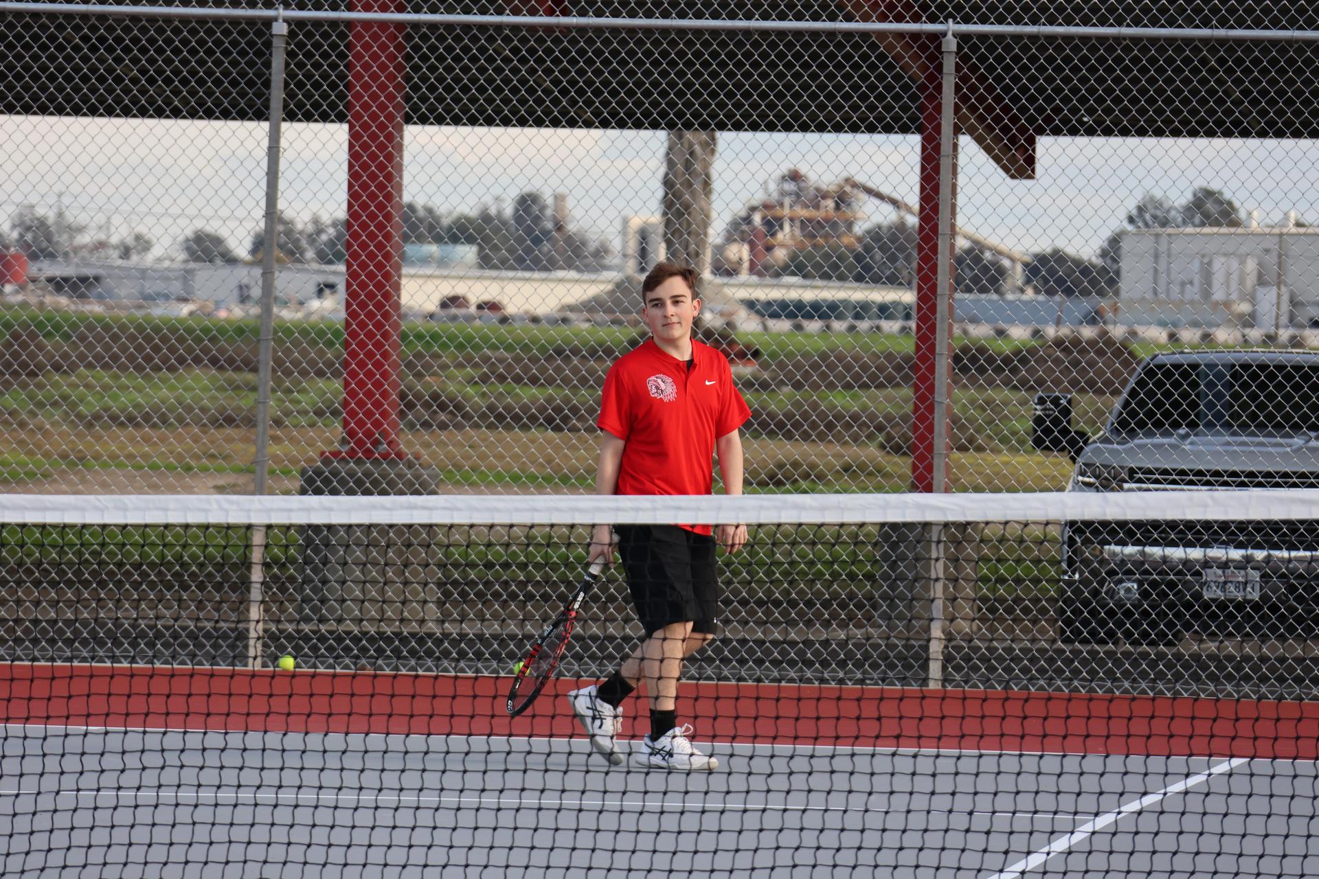 CUHS Boys playing tennis against coalinga