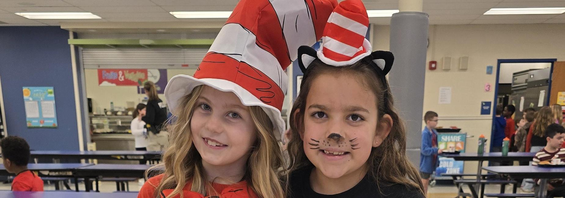 Two second grade girls dressed up as Cat in the Hat