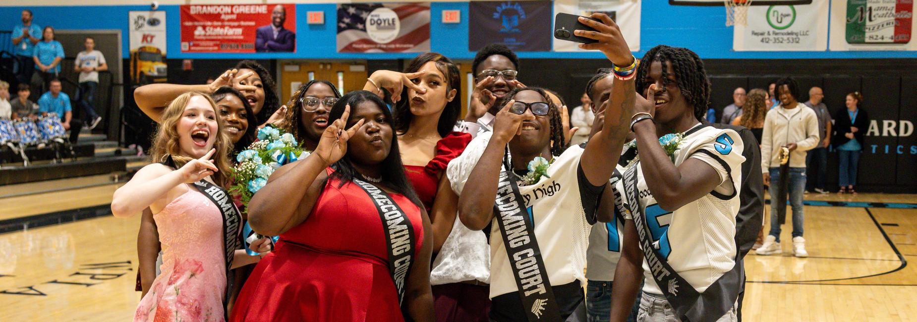 The homecoming court poses for a selfie