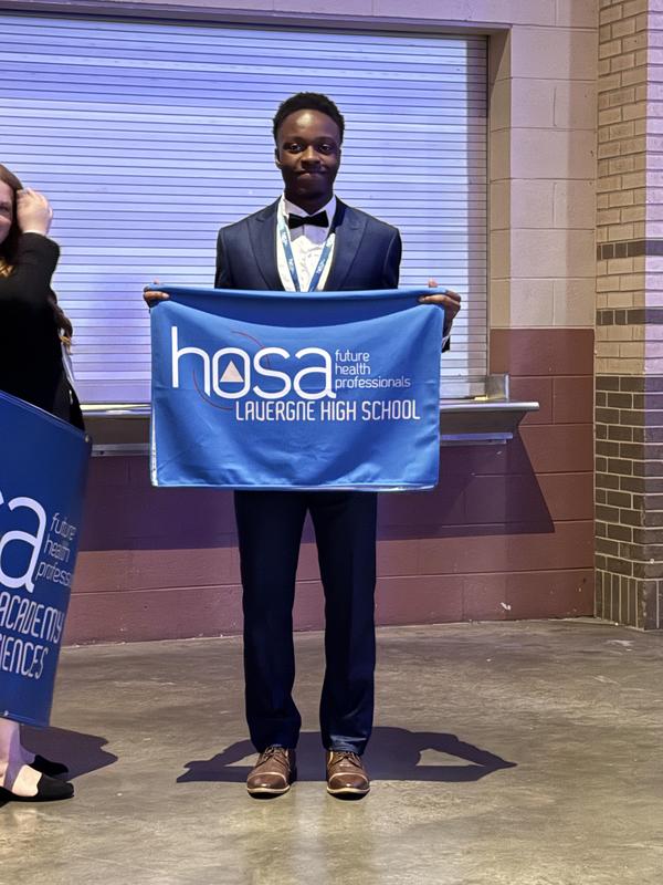 Smiling teens dressed in professional attire