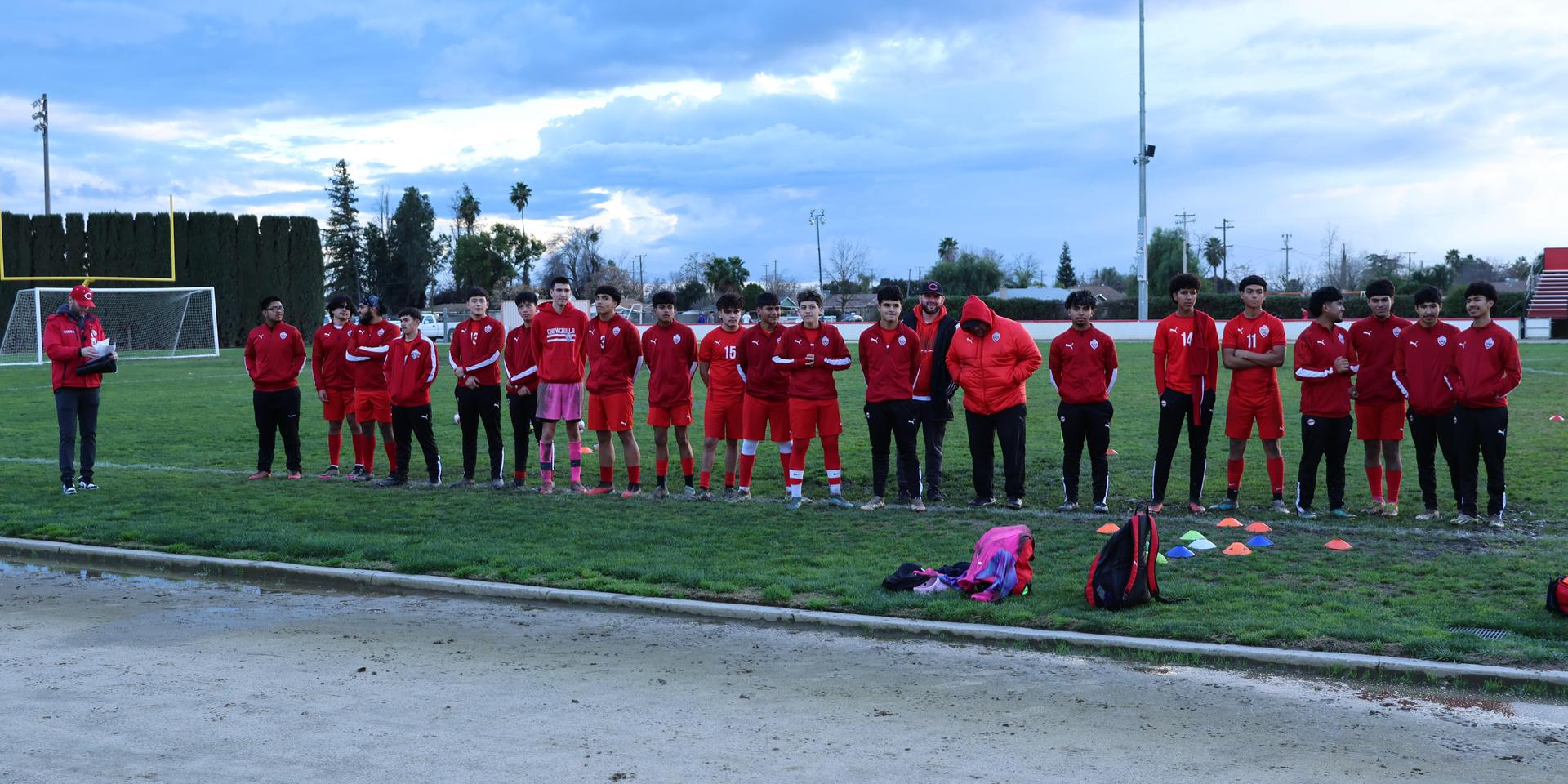 boys varsity soccer team players posing