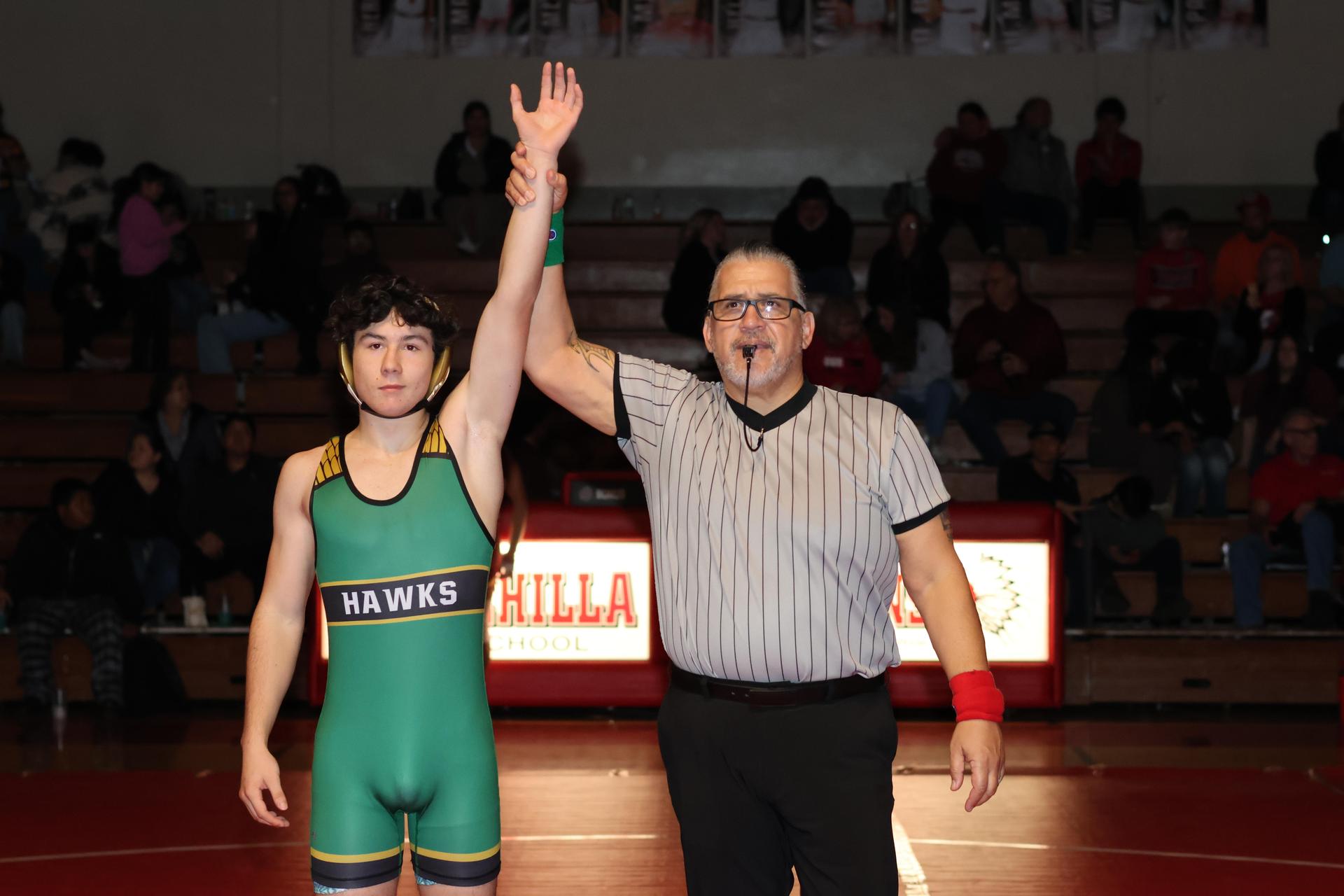 Wrestling winners with hands up 66