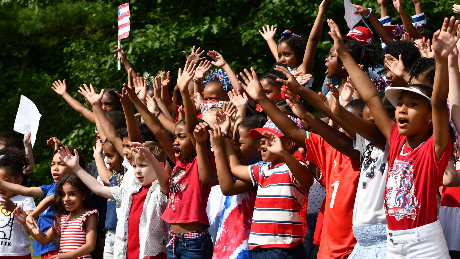 Students sing at Kennedy Commemoration Day