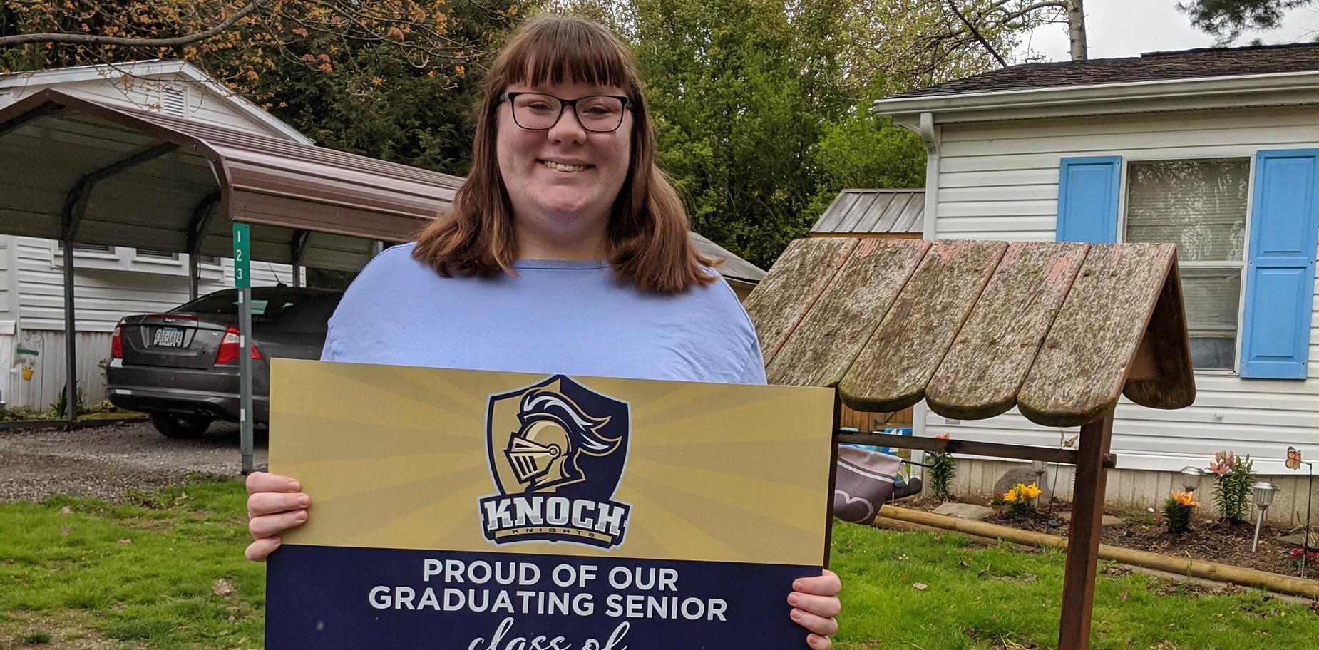 Senior receiving cap and gown