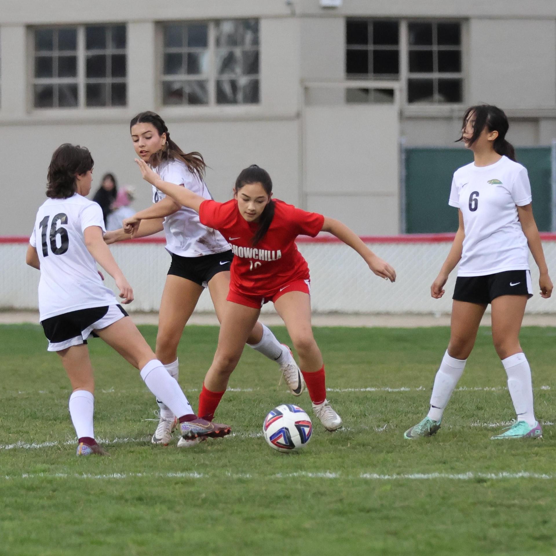 Junior varsity girls playing soccer against liberty