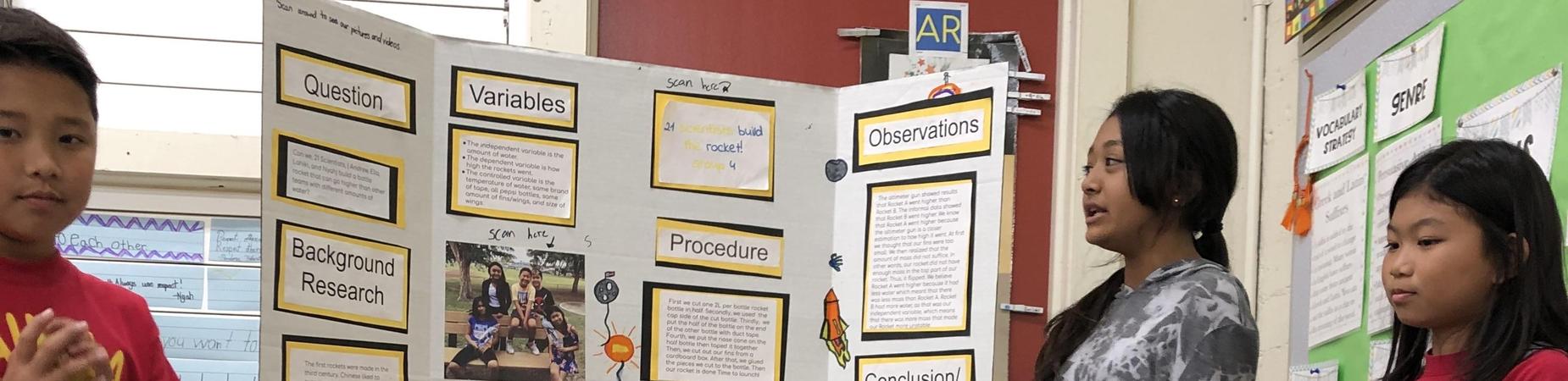 3 fifth grade students sharing science project