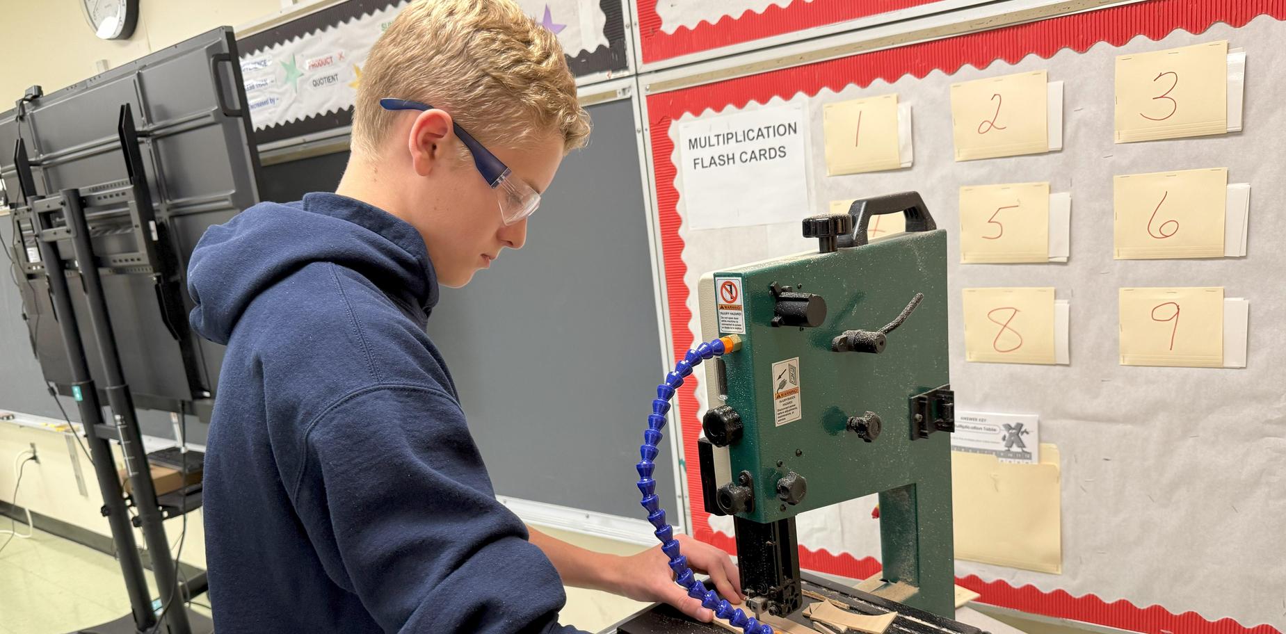 boy using a saw