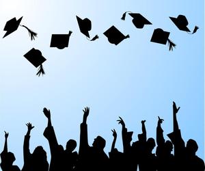 Shadowy figures throwing graduation caps in the air.